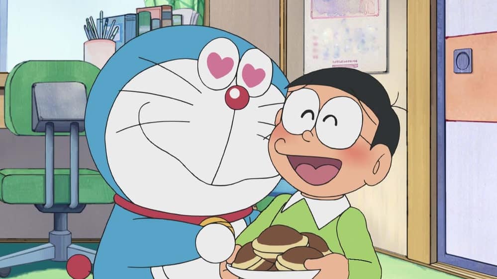 Hình Doremon và Nobita dễ thương ăn bánh rán